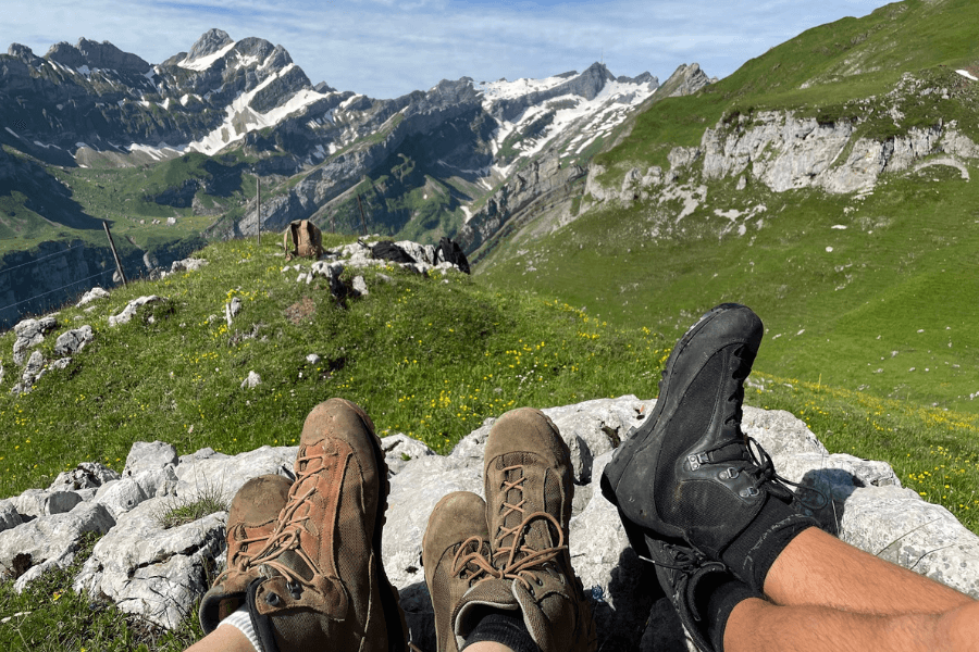 trekking boots and mountains in the background